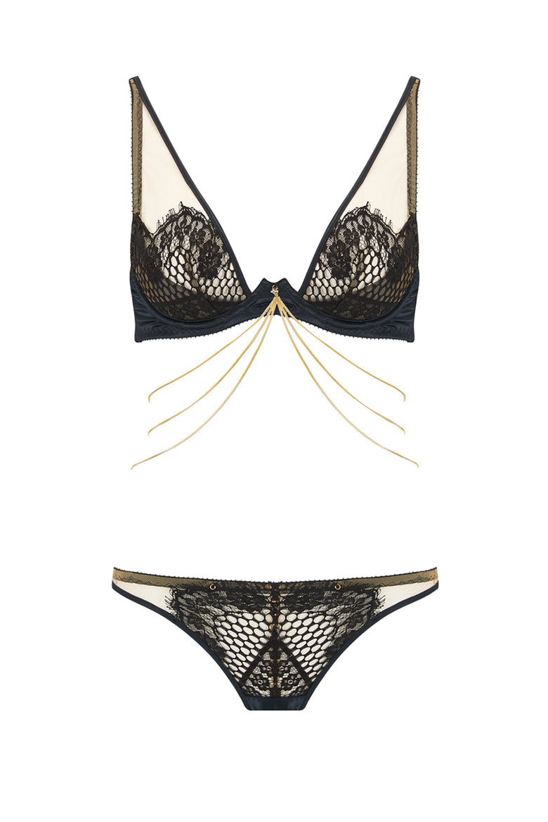 Designed with dramatic cut outs, satin bound edges and a fishnet style scalloped lace, the Kathryn thong plays with positive and negative space to create high drama lingerie shown with bra and 18k gold plated chains